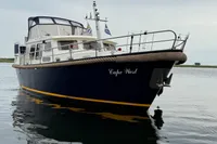 Custom Knight Craft 12,50 yacht from 2005, named "Cape West," on calm water.