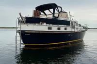 Custom Knight Craft 12,50 boat, 2005 model, anchored on calm water.