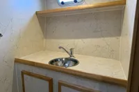 Marble countertop with sink in 2005 Custom Knight Craft 12,50 boat interior.
