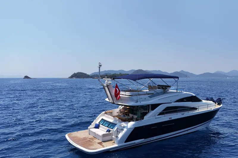  Yacht Photos Pics Luxurious 2013 Fairlane Squadron yacht cruising on serene blue waters.