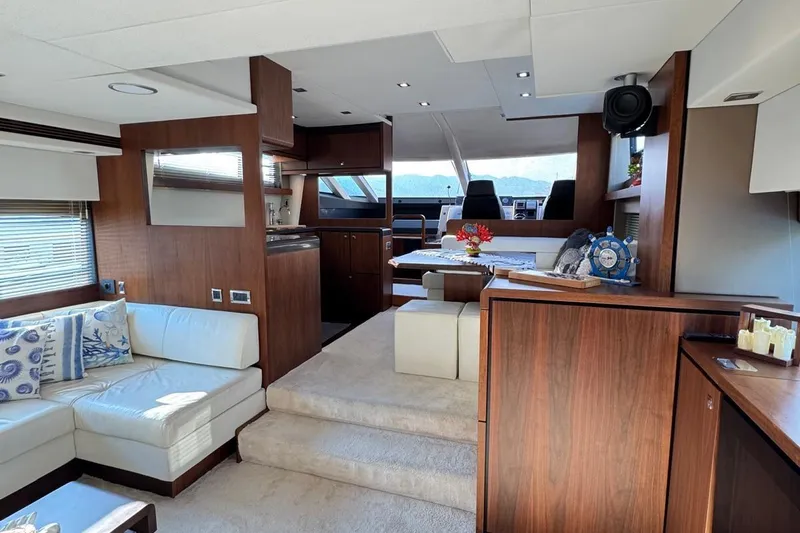  Yacht Photos Pics Luxurious 2013 Fairlane Squadron yacht interior with elegant wood finishes and plush seating.