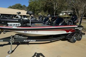 2017 Nitro Z20 Pro boat on trailer, parked outdoors, with visible registration number.