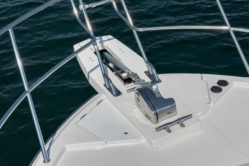 Sea Horse Yacht Photos Pics 2023 Cutwater 288 Coupe LE boat anchor system on deck, surrounded by water.