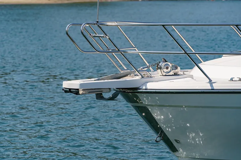 Sea Horse Yacht Photos Pics 2023 Cutwater 288 Coupe LE boat bow with stainless steel railings on water.