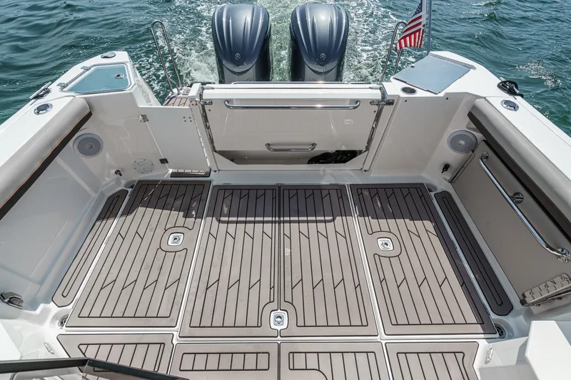 Sea Horse Yacht Photos Pics 2023 Cutwater 288 Coupe LE boat deck with twin engines and American flag.
