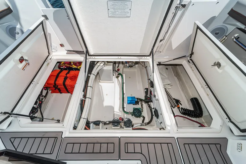 Sea Horse Yacht Photos Pics 2023 Cutwater 288 Coupe LE engine compartment with storage and safety equipment.