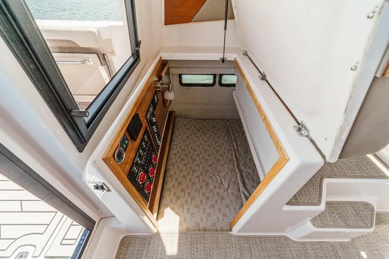 Sea Horse Yacht Photos Pics 2023 Cutwater 288 Coupe LE interior with control panel and storage area.