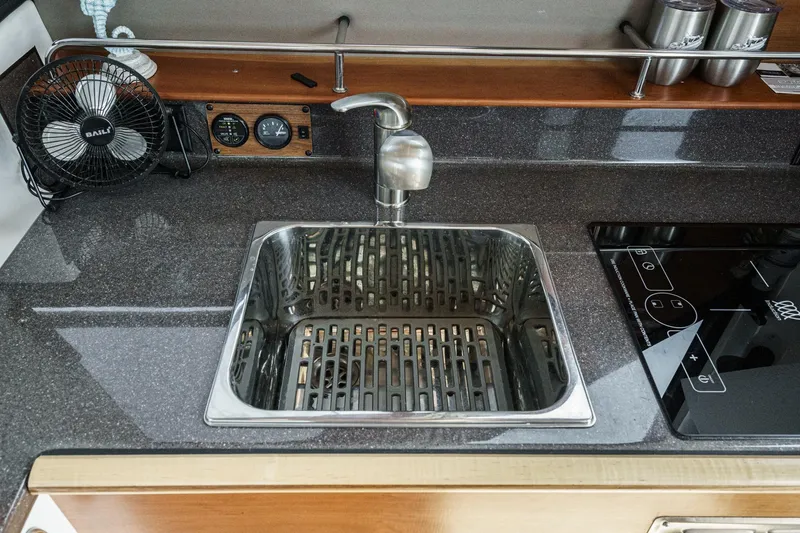 Sea Horse Yacht Photos Pics Modern kitchen sink and stovetop in 2023 Cutwater 288 Coupe LE boat.