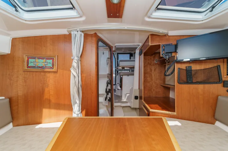 Sea Horse Yacht Photos Pics Interior of 2023 Cutwater 288 Coupe LE, featuring wood paneling and modern amenities.