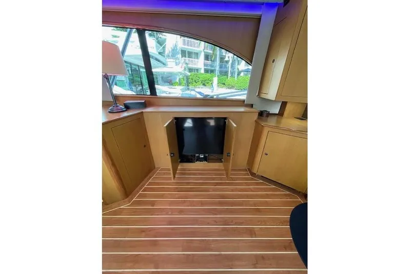 Ala-ash Yacht Photos Pics Interior of 2003 Post Flybridge Convertible yacht with wooden flooring and cabinetry.