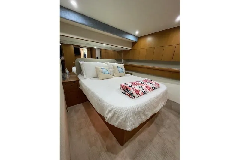 Ala-ash Yacht Photos Pics Luxurious bedroom interior of 2003 Post Flybridge Convertible yacht with cozy bedding.
