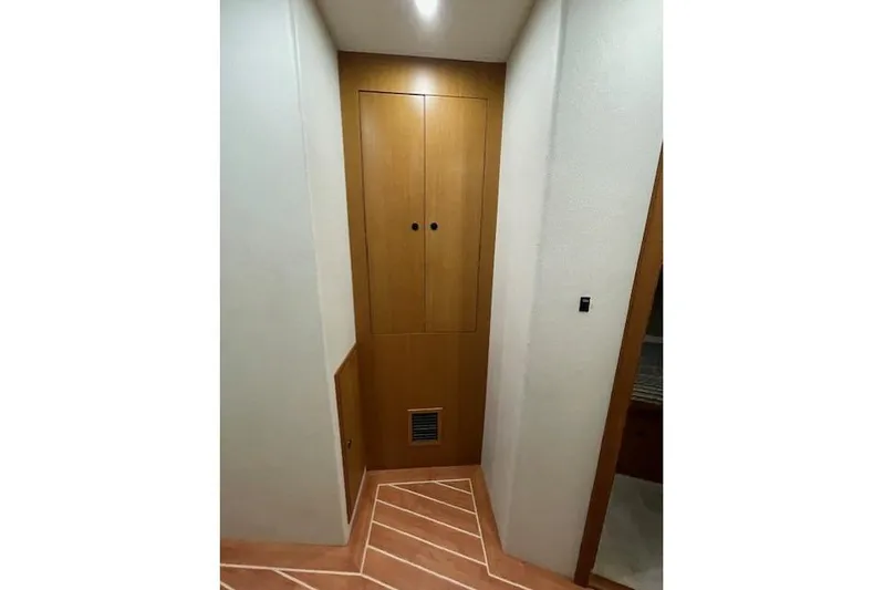 Ala-ash Yacht Photos Pics Interior hallway of 2003 Post Flybridge Convertible with wooden cabinet and modern design.