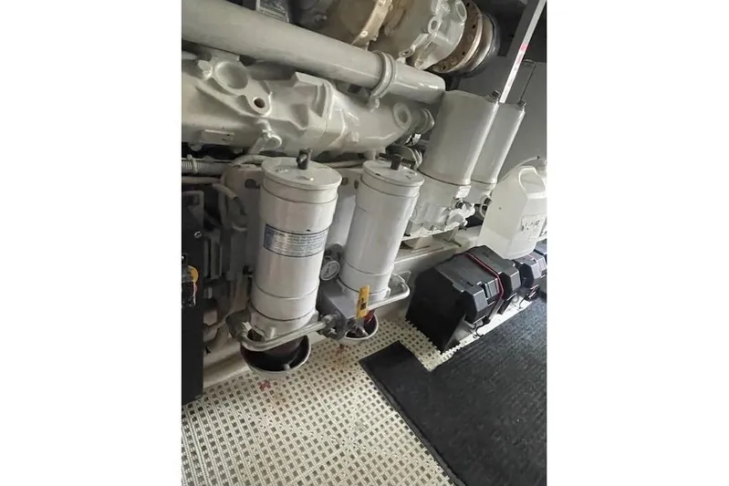 Ala-ash Yacht Photos Pics Engine room of 2003 Post Flybridge Convertible, showcasing filters and components.