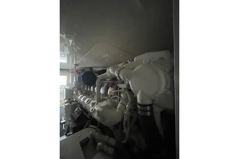 Ala-ash Yacht Photos Pics Engine room of 2003 Post Flybridge Convertible boat, showcasing detailed machinery components.