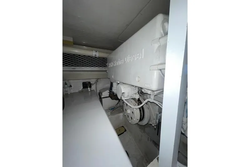 Ala-ash Yacht Photos Pics Engine room of 2003 Post Flybridge Convertible with marine diesel engine.