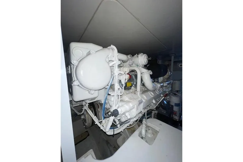 Ala-ash Yacht Photos Pics Engine room of a 2003 Post Flybridge Convertible boat, showcasing machinery and components.