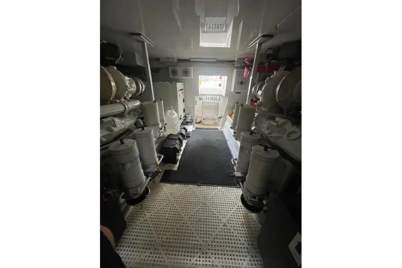 Ala-ash Yacht Photos Pics Engine room of 2003 Post Flybridge Convertible yacht, showcasing machinery and equipment.