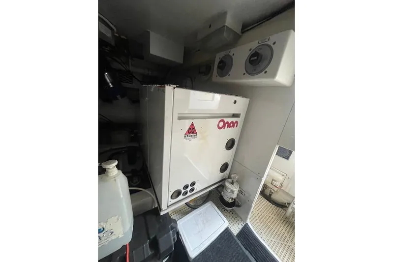 Ala-ash Yacht Photos Pics Engine room of 2003 Post Flybridge Convertible with Onan generator and CO warning label.