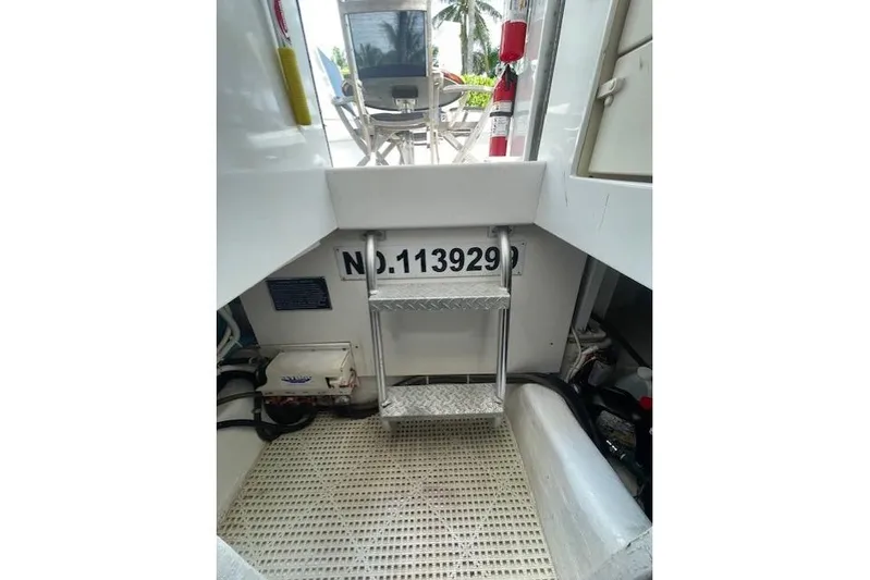 Ala-ash Yacht Photos Pics 2003 Post Flybridge Convertible boat interior with ladder and equipment.