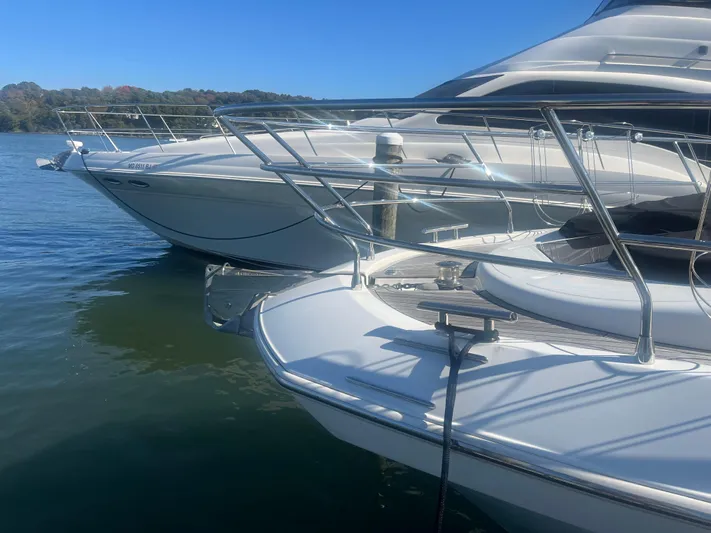  Yacht Photos Pics 2013 Azimut 40 Flybridge yacht docked on calm water.