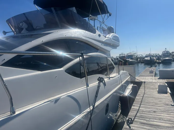  Yacht Photos Pics Azimut 40 Flybridge 2013 yacht docked at marina under clear blue sky.
