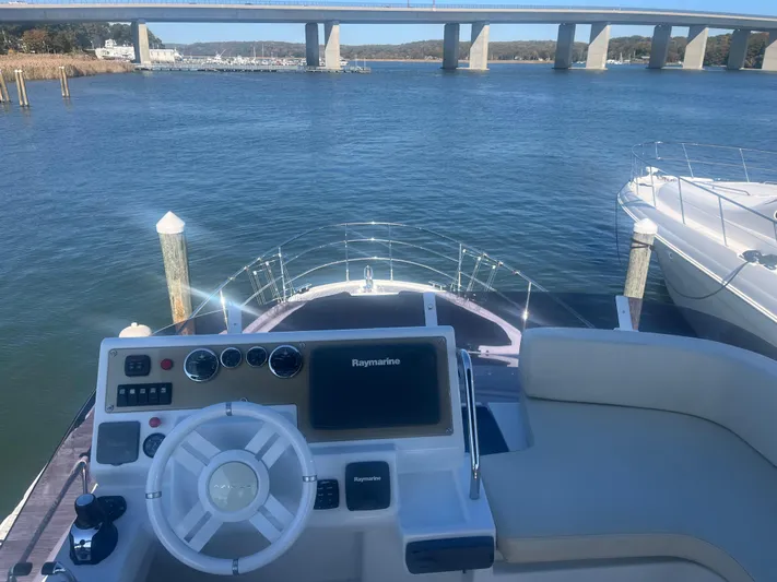  Yacht Photos Pics 2013 Azimut 40 Flybridge yacht helm with water and bridge view.