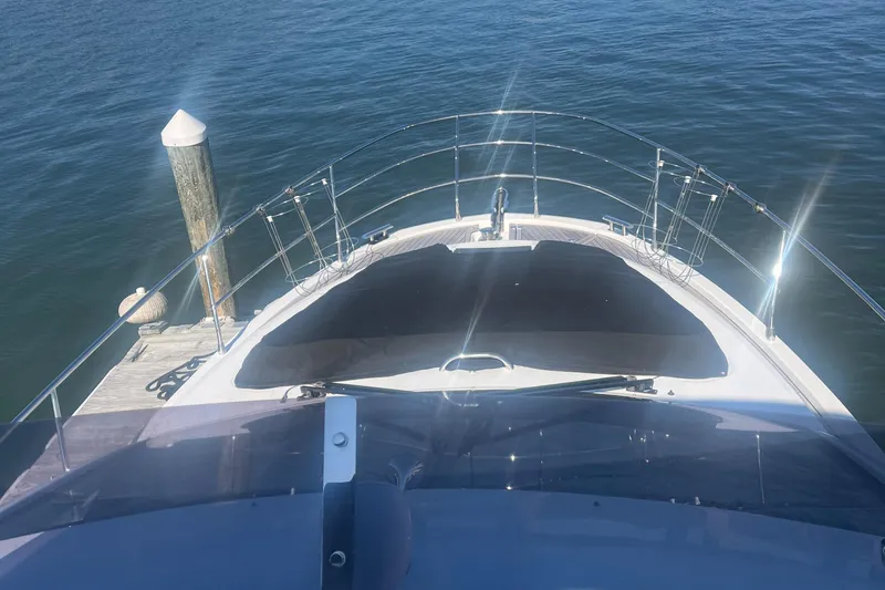  Yacht Photos Pics Azimut 40 Flybridge 2013 yacht docked, view from flybridge over water.