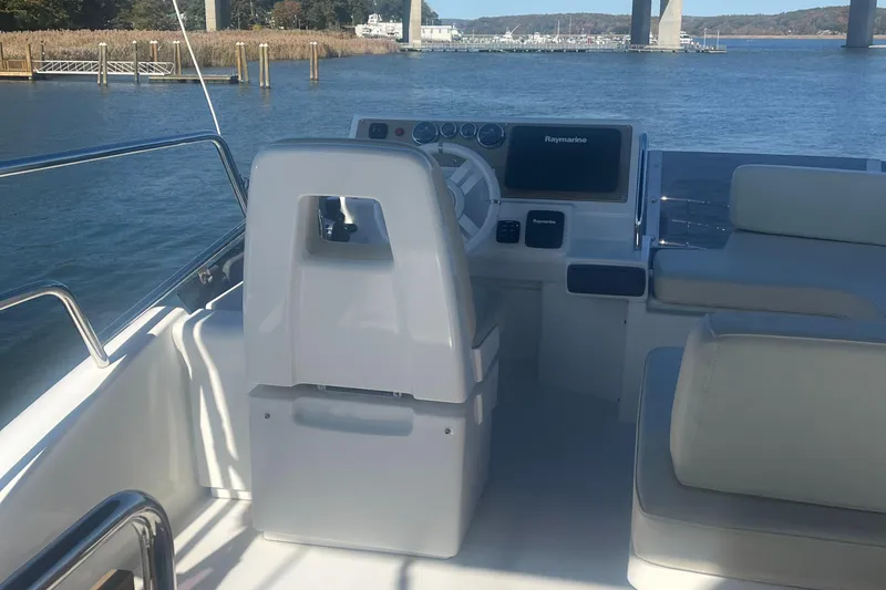  Yacht Photos Pics Azimut 40 Flybridge 2013 yacht helm with scenic waterway view.