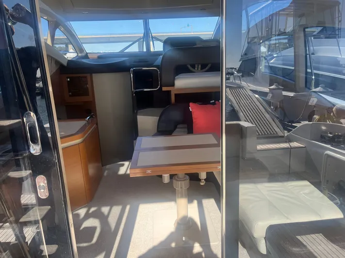  Yacht Photos Pics Interior view of 2013 Azimut 40 Flybridge yacht, featuring seating and table.