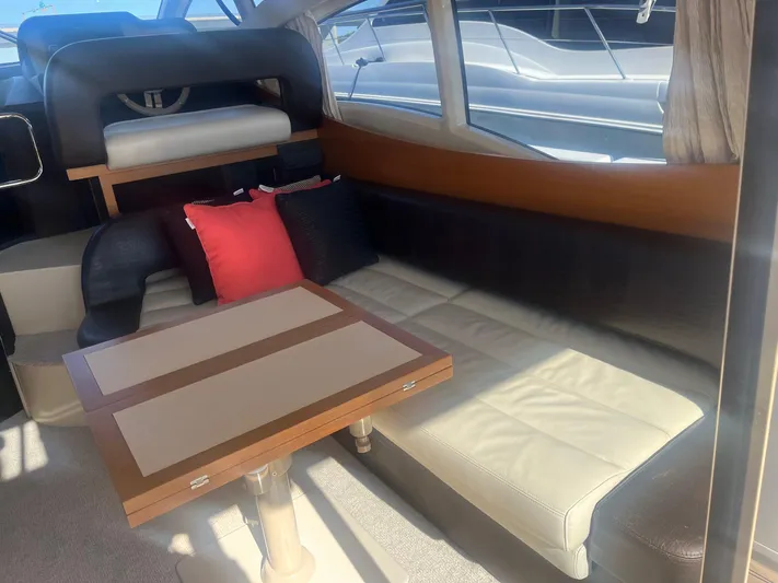  Yacht Photos Pics Interior of 2013 Azimut 40 Flybridge yacht with seating and table.