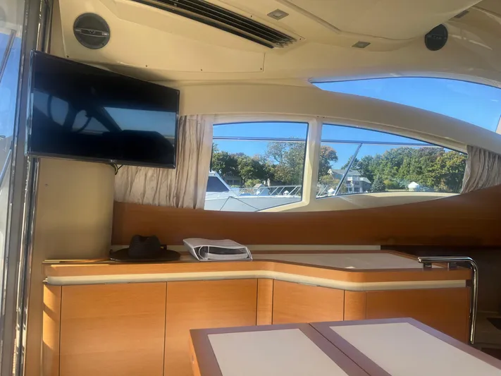  Yacht Photos Pics Interior of 2013 Azimut 40 Flybridge yacht with TV and scenic window view.