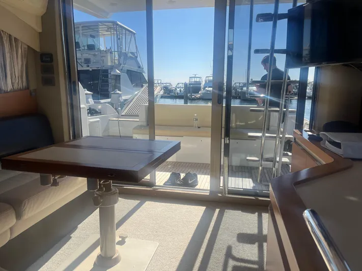  Yacht Photos Pics Interior view of 2013 Azimut 40 Flybridge yacht with marina in background.