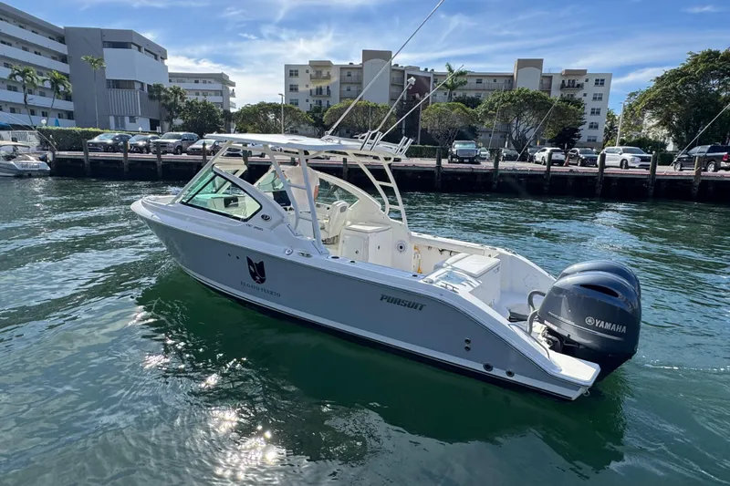  Yacht Photos Pics 2022 Pursuit DC 266 Dual Console boat with Yamaha engine on calm water.