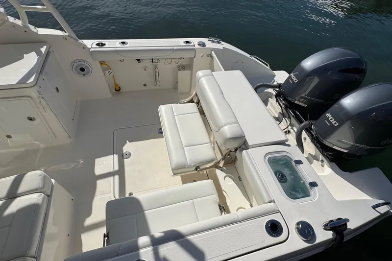  Yacht Photos Pics 2022 Pursuit DC 266 Dual Console boat interior with seating and twin 200 horsepower engines.