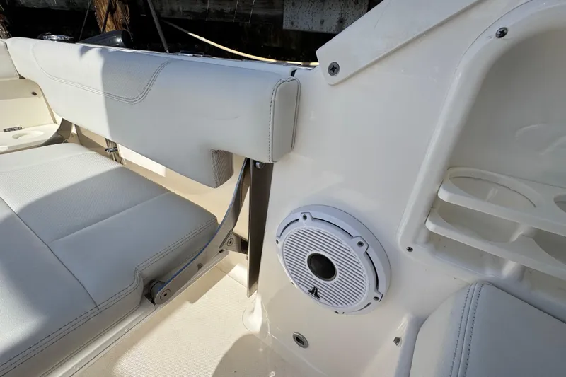  Yacht Photos Pics 2022 Pursuit DC 266 Dual Console interior with seating and speaker detail.