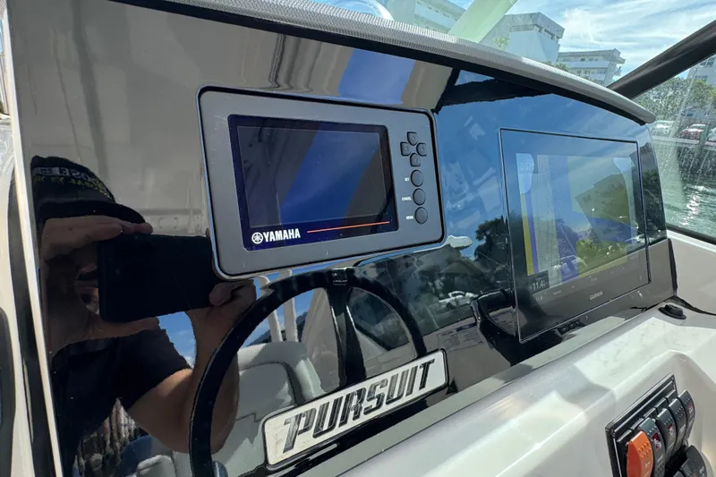  Yacht Photos Pics 2022 Pursuit DC 266 Dual Console dashboard with Yamaha and Garmin displays.