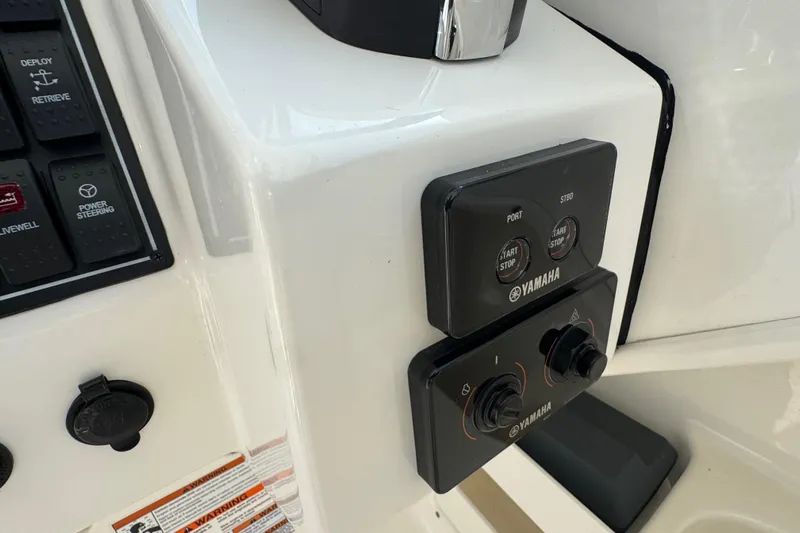  Yacht Photos Pics Control panel of 2022 Pursuit DC 266 Dual Console boat with Yamaha start/stop buttons.