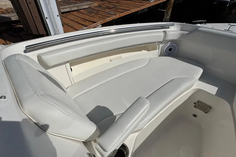 Yacht Photos Pics 2022 Pursuit DC 266 Dual Console boat interior with white cushioned seating.