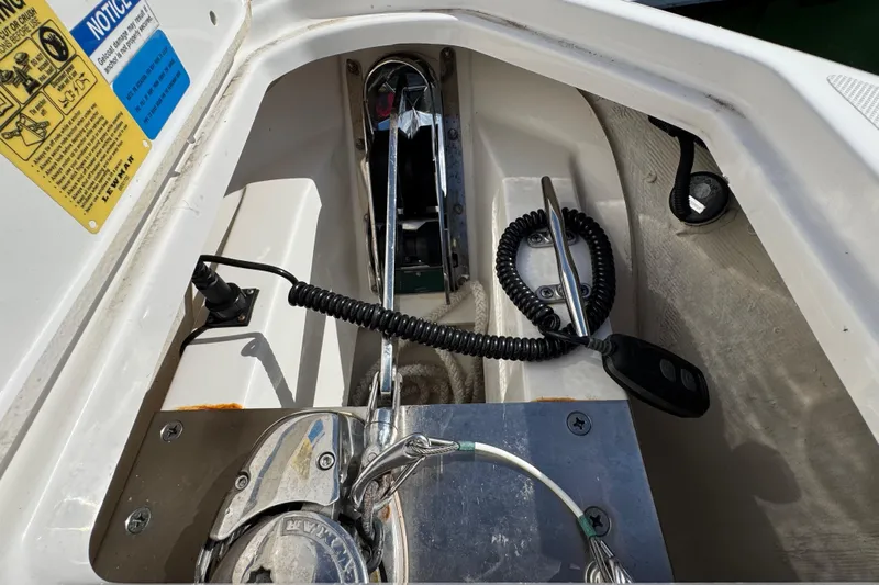  Yacht Photos Pics 2022 Pursuit DC 266 Dual Console boat anchor compartment with control panel and wiring.