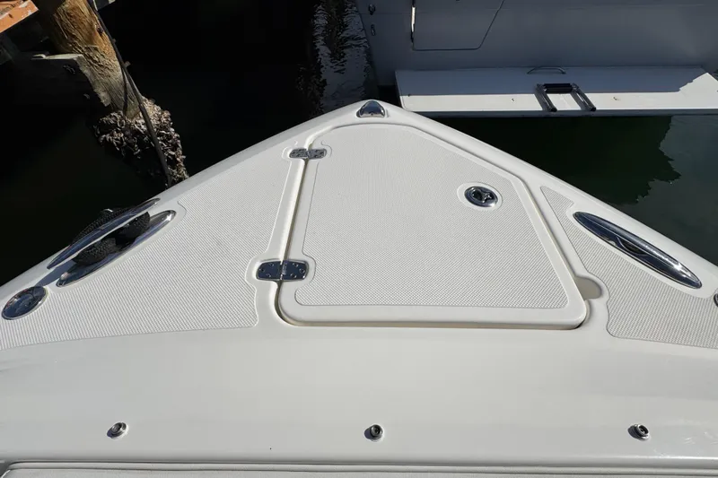  Yacht Photos Pics 2022 Pursuit DC 266 Dual Console boat deck with storage hatch and cleats.