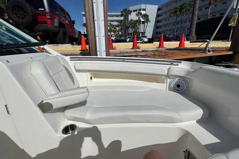  Yacht Photos Pics 2022 Pursuit DC 266 Dual Console boat interior with white seating and speaker.