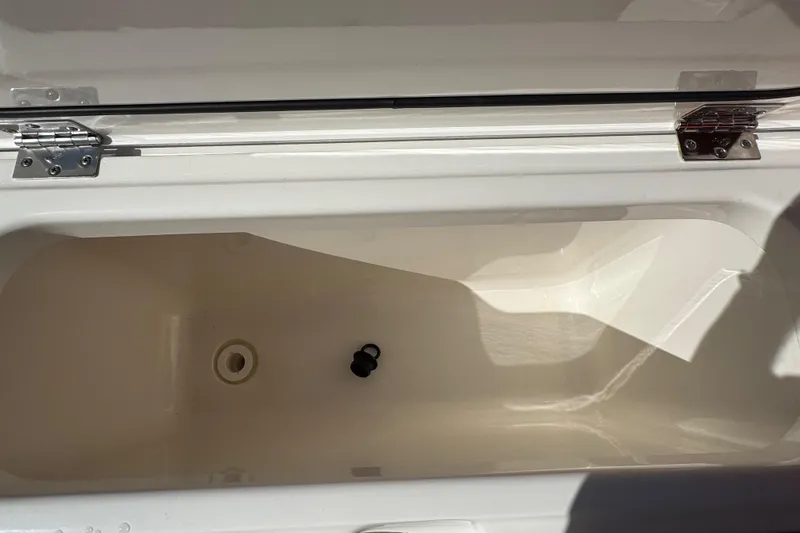  Yacht Photos Pics Open storage compartment of 2022 Pursuit DC 266 Dual Console boat.
