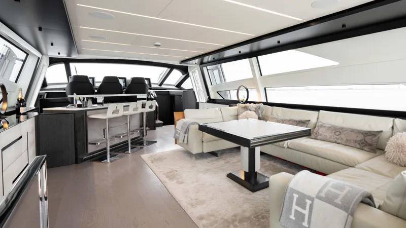 Stallion Yacht Photos Pics Luxurious interior of 2022 Pershing 9X yacht with modern furnishings and panoramic windows.