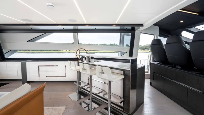 Stallion Yacht Photos Pics Modern interior of 2022 Pershing 9X yacht with sleek bar and seating area.