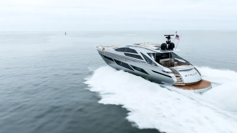 Stallion Yacht Photos Pics 2022 Pershing 9X yacht cruising on open water, showcasing sleek design and luxury.
