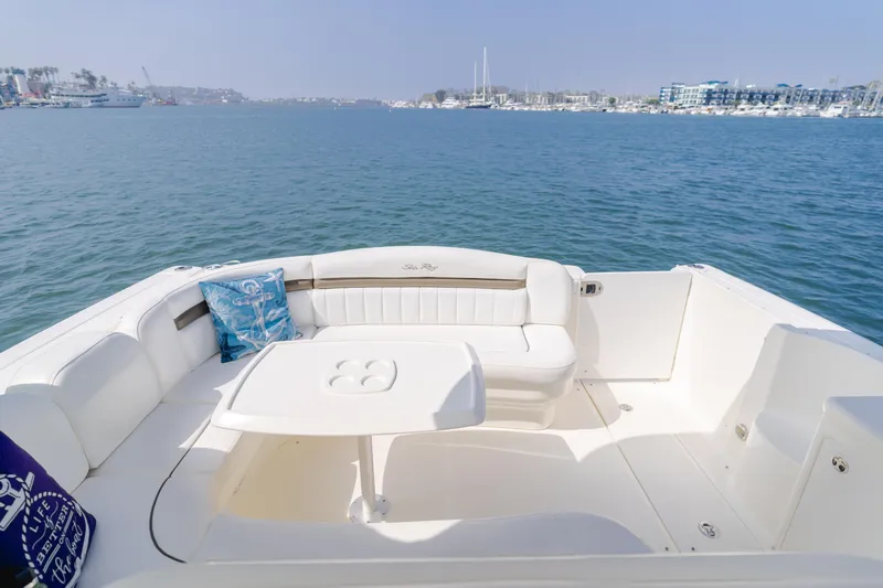 Sea-rinity Yacht Photos Pics 2007 Sea Ray 40 Sundancer boat deck with seating and table, overlooking marina.