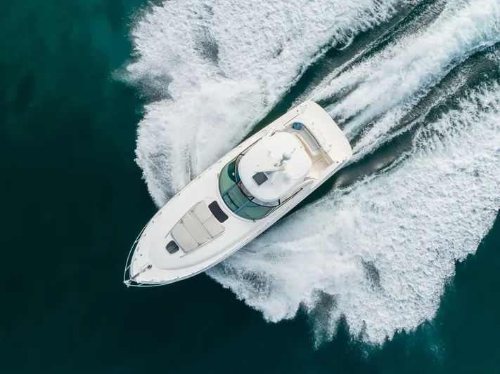 Sea-rinity Yacht Photos Pics Aerial view of 2007 Sea Ray 40 Sundancer cruising on open water.