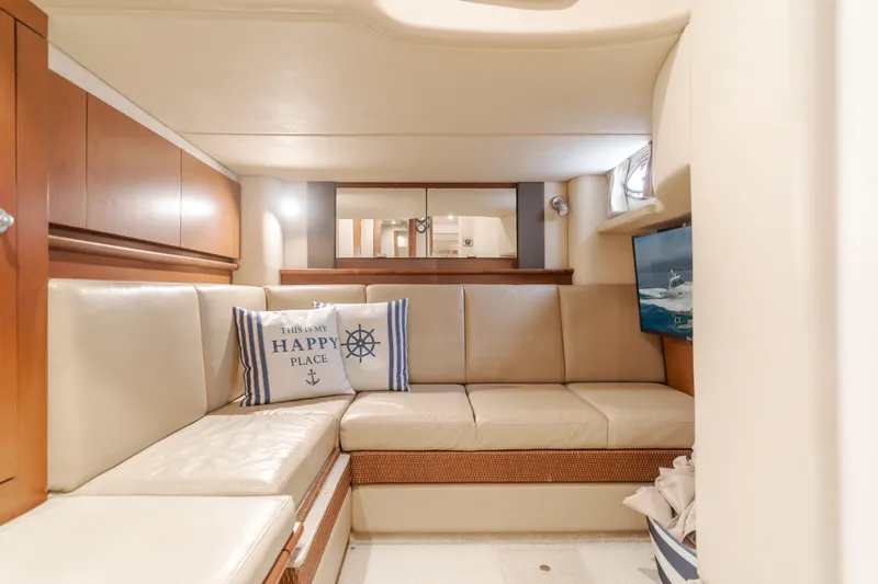 Sea-rinity Yacht Photos Pics Luxurious interior of 2007 Sea Ray 40 Sundancer yacht with beige leather seating.