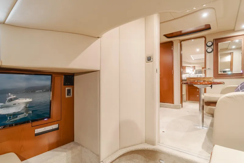 Sea-rinity Yacht Photos Pics Interior of 2007 Sea Ray 40 Sundancer yacht with TV, dining area, and luxurious furnishings.