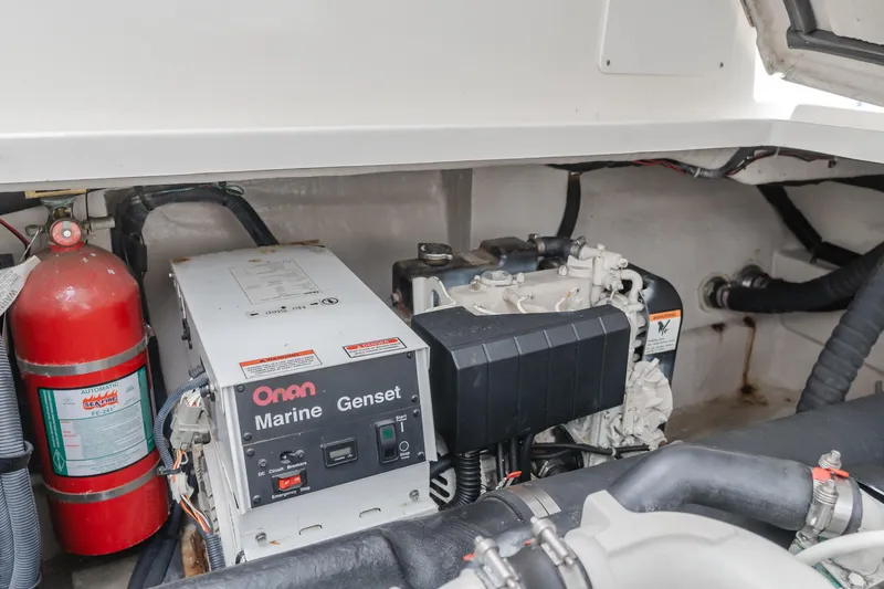 Sea-rinity Yacht Photos Pics Engine compartment of a 2007 Sea Ray 40 Sundancer with Onan Marine Genset and fire extinguisher.